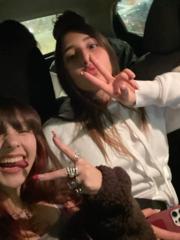 Young women take group selfies in Petah Tikva