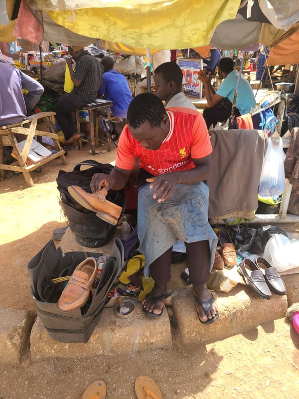 Street vendors conduct business across city sidewalks