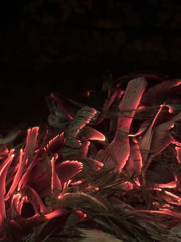 Plant material burns with glowing embers in Bulgarian village