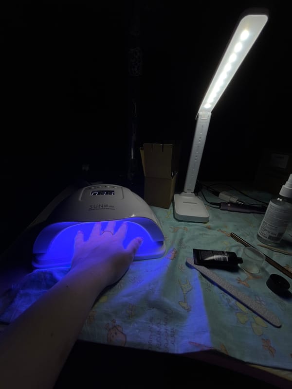 Woman gets manicure treatment in Novopokrovskaya, Russia