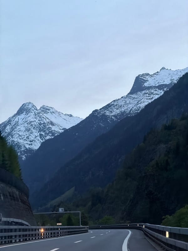 Snow-capped mountains observed from highway in Gurtnellen, Switzerland