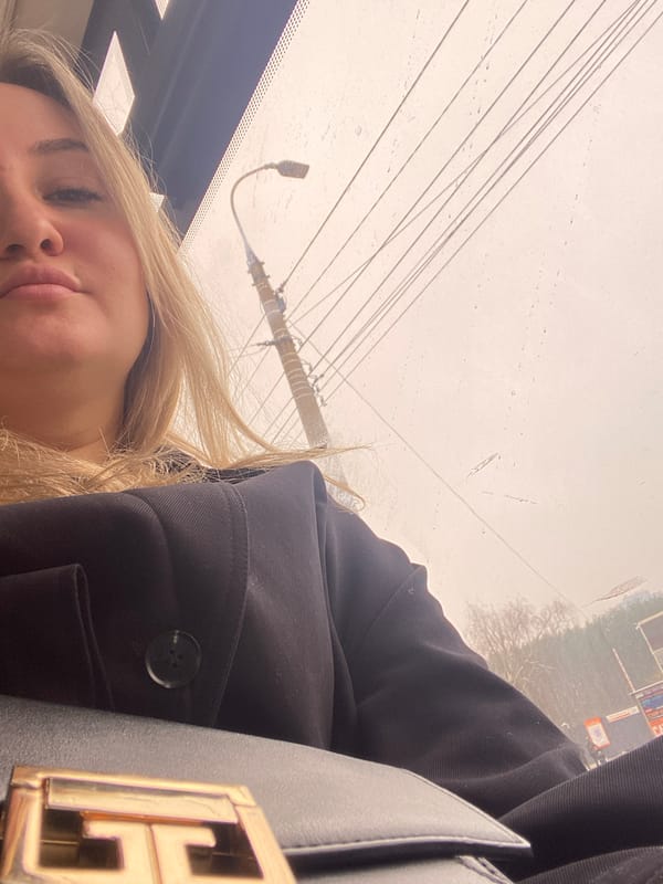 Woman in vehicle during rainy weather in Izhevsk