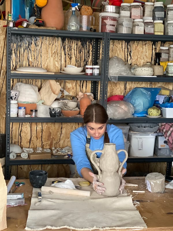 Woman works clay at Moscow pottery workshop
