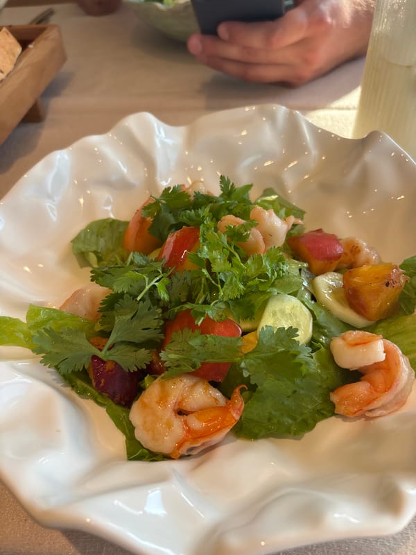 Lunch at a Bor restaurant, salad and bread on the table