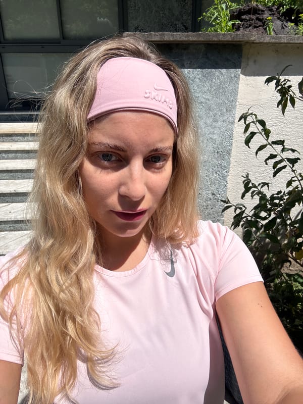 Woman in pink athletic wear spotted around Paris