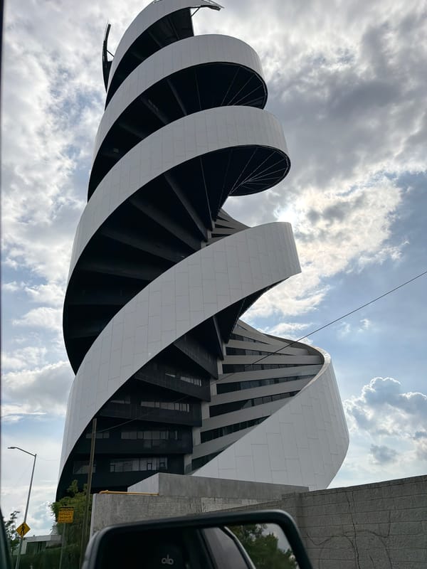Modern spiral building observed from vehicle in Tlaxcalancingo, Mexico