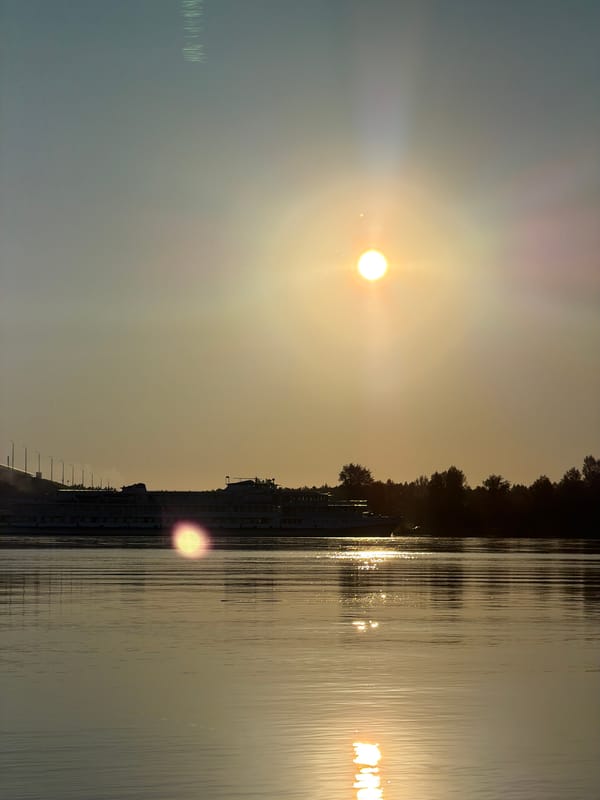 Sunset fishing on the Volga, bridge and cruise ship in view