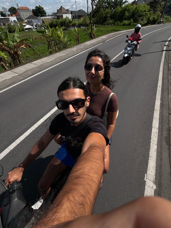 Couple films scooter ride selfies in North Kuta