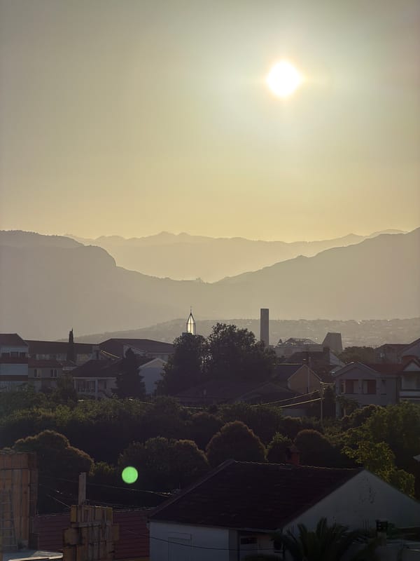 Rooftop views over Podgorica with hills beyond
