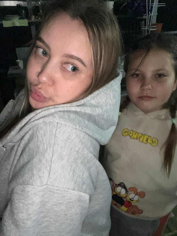 Two women take playful selfies in Novopokrovskaya