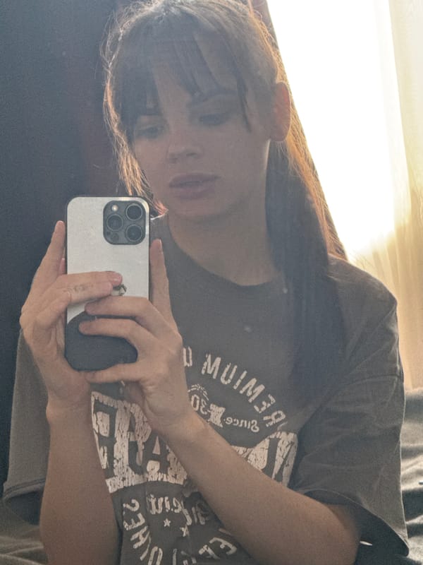 Woman takes morning bedroom selfies in Rostov-on-Don apartment