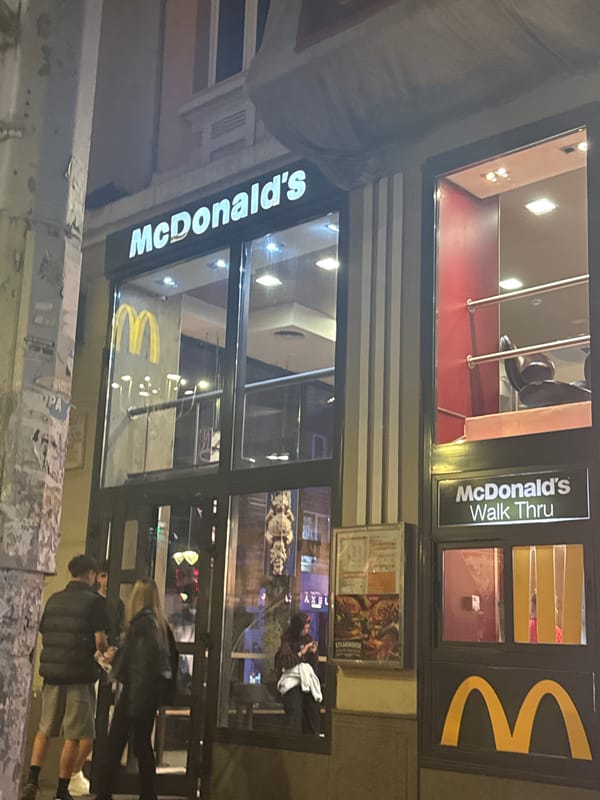 Urban evening scenes capture McDonald's storefront, tram on city street