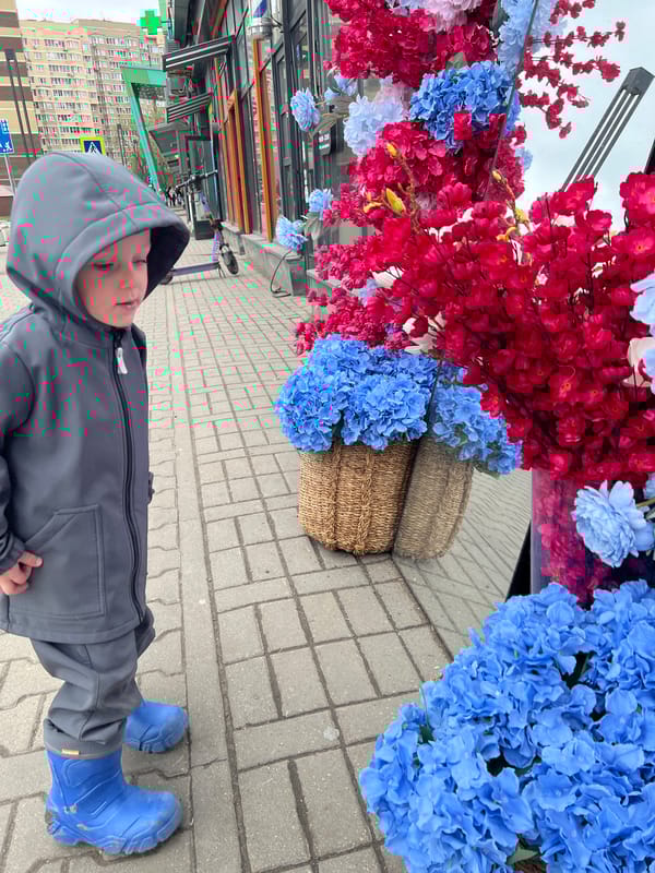 Child and dog share morning moments in Mytishchi
