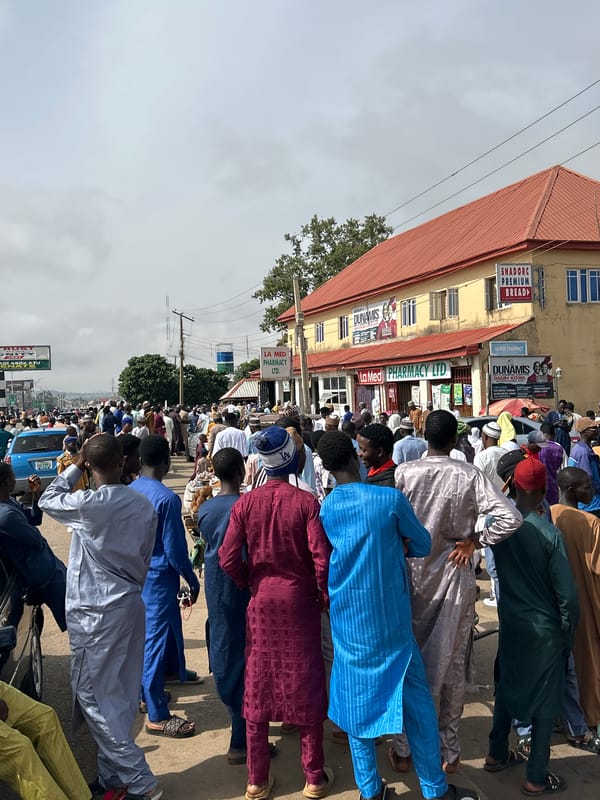 Traditional-dressed crowds gather on Jos Nigeria streets