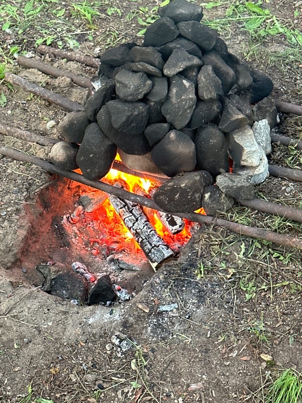 Traditional outdoor cooking fire documented in rural Belarus village