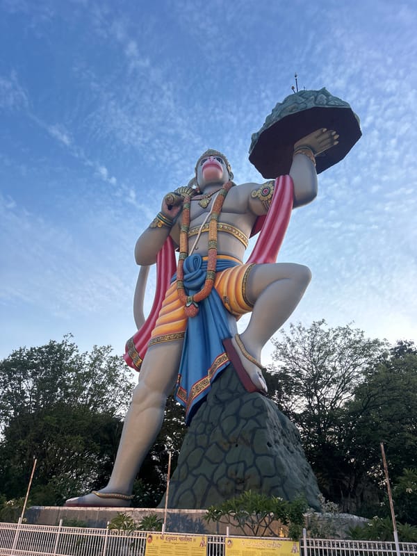 Daily life and religious statue observed in Puttaparthi