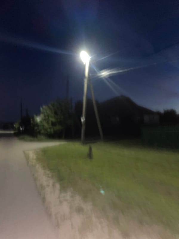 Evening photography sequence documents rural Russian settlement twilight scenes