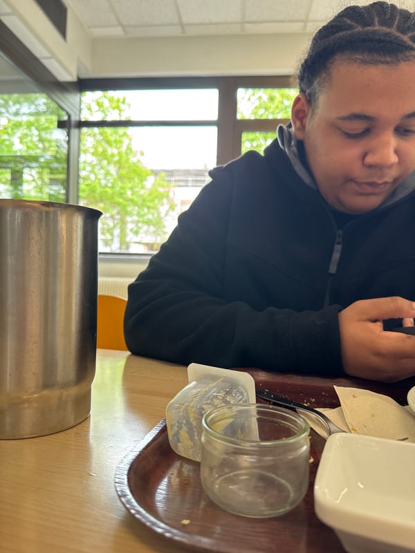 Person rests with closed eyes in Schiltigheim dining area