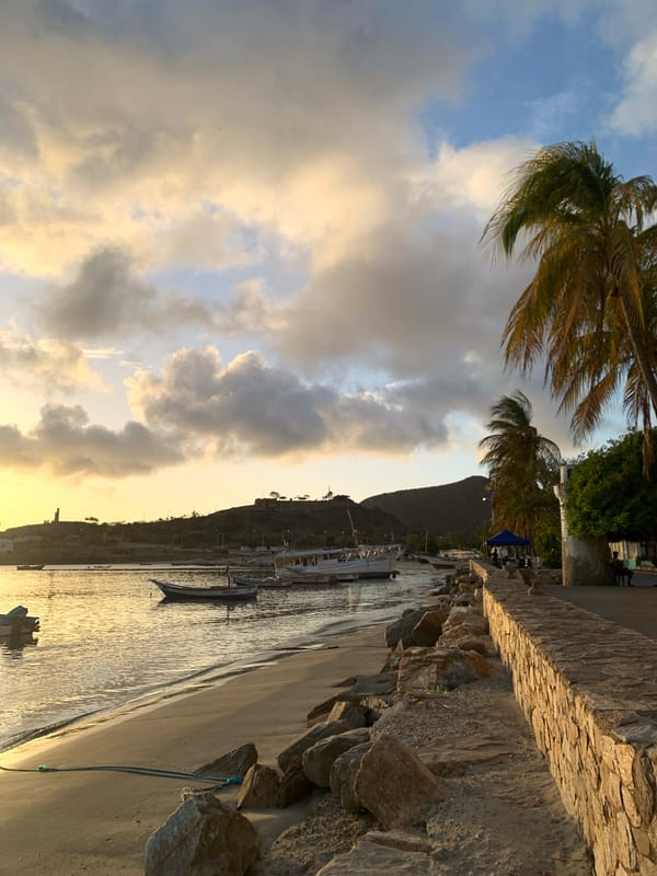 Sunset over Juan Griego bay and streets below
