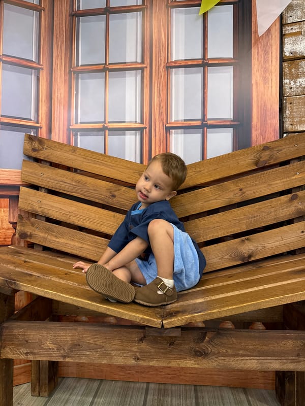 Rustic studio portrait session with child and adult, rural Russia