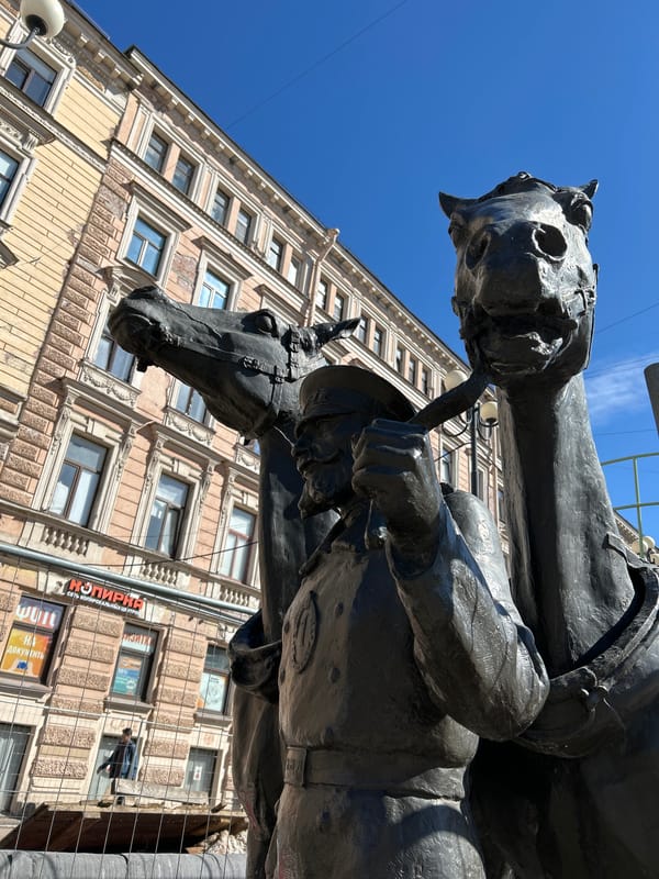 Street performer draws crowds near historic statue in Saint Petersburg