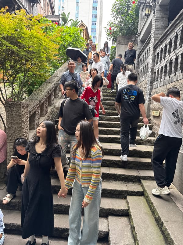 Morning crowds pack historic Yuzhong District streets and cafes