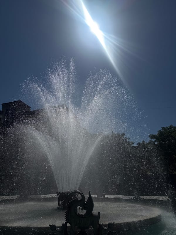 Fountain operates at Yerevan's Charles Aznavour Square on sunny morning