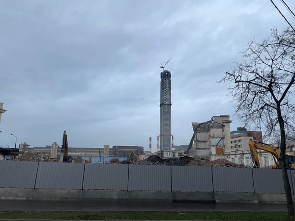 Building demolition underway in Moscow with heavy machinery