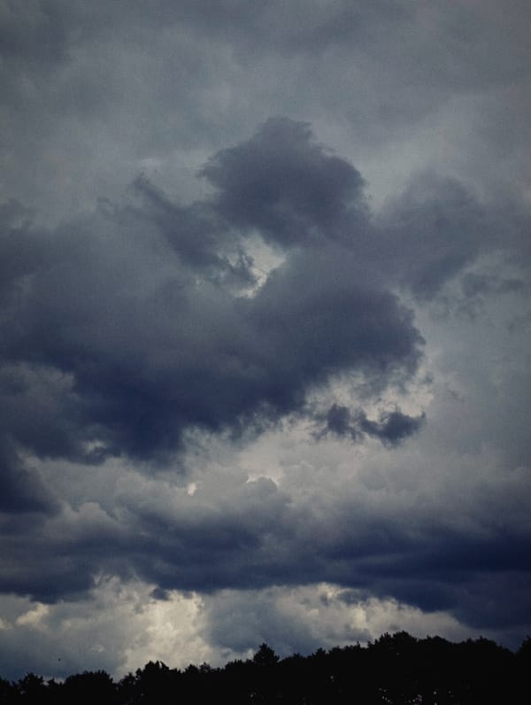 Storm clouds gather over Minsk neighborhoods on a July morning