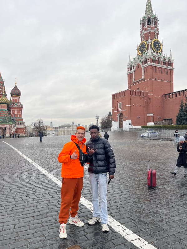 Young men pose on Moscow pedestrian crossing