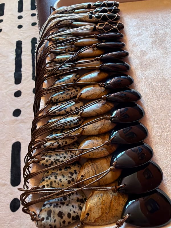 Polished stone pendants arranged in a velvet tray, Khimki