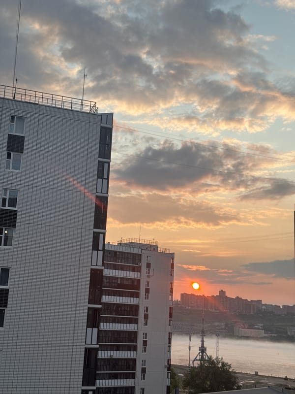 Sunset breaks over Krasnoyarsk's modern apartment skyline