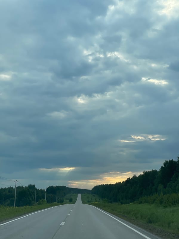 Solo traveler documents early morning road trip with selfies