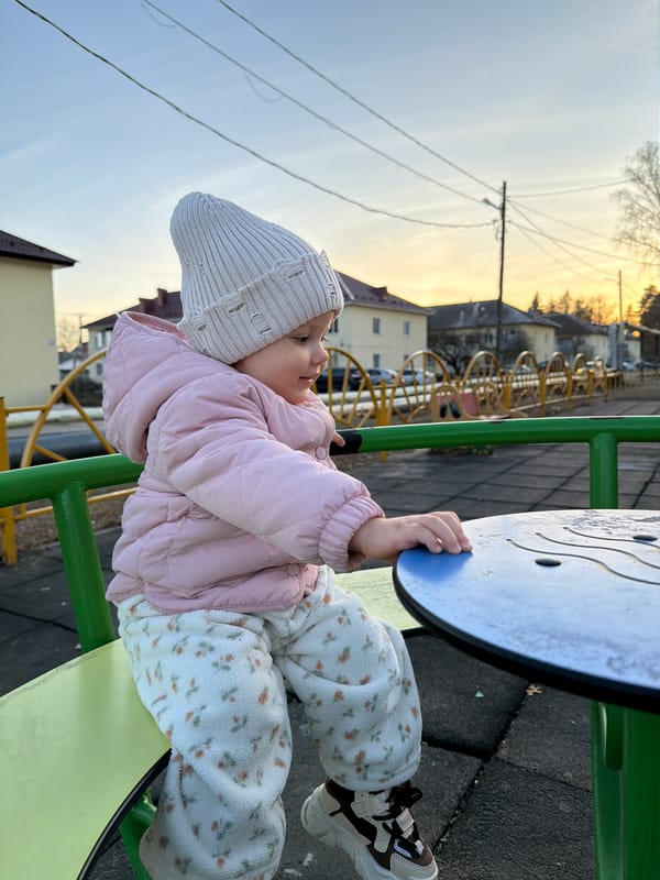 Family day in Reshetnikovo: toddler plays, woman drinks protein shakes