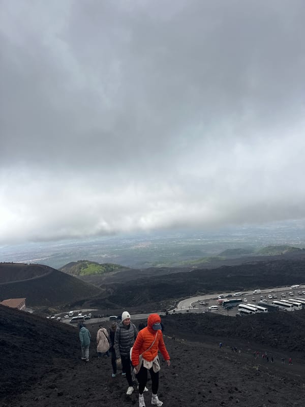Tourists gather on Mount Etna's volcanic slopes near Nicolosi