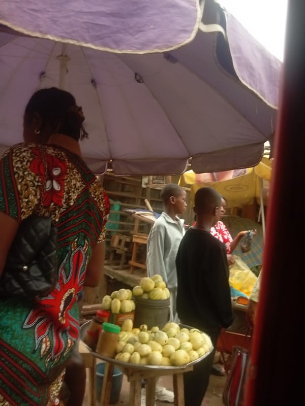 Woman conducts morning market business in Nkpor, Nigeria