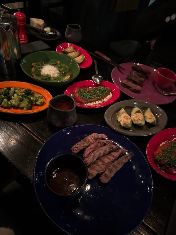 Candlelit dinner documented at Moscow restaurant featuring colorful plates