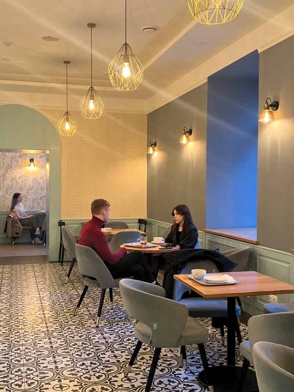 Cafe dining and pastry browsing captured in Minsk