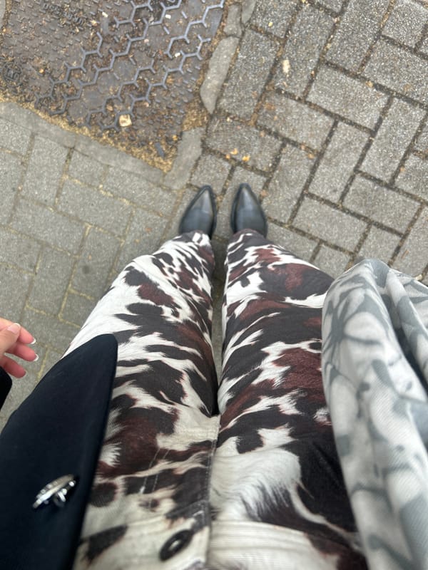 Woman in cow-print pants spotted at Milan bus stop