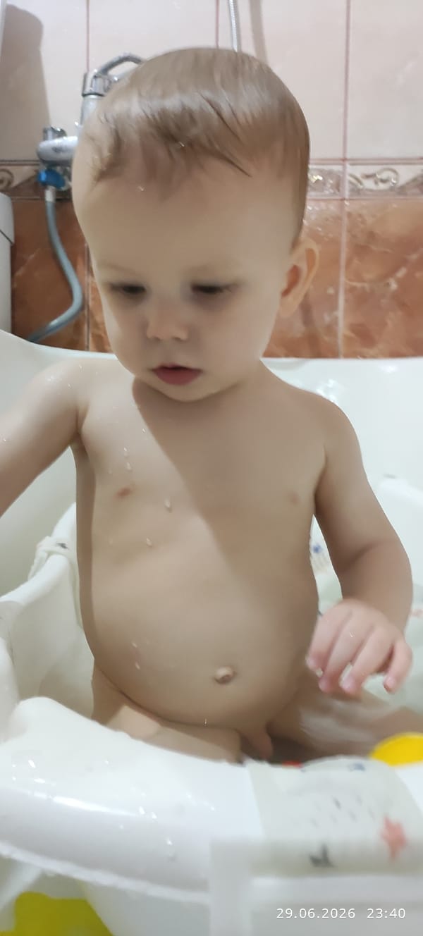 Baby's bath time, multiple angles in a tiled bathroom