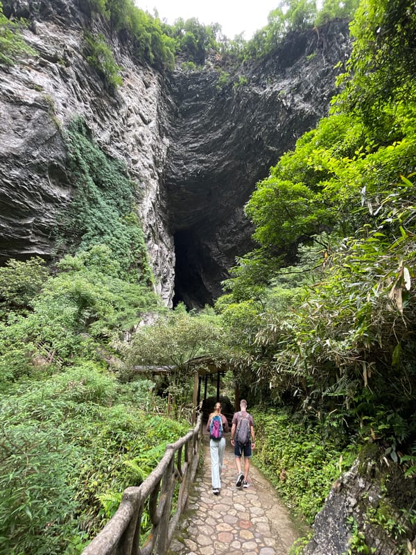Tourists visit Erwang Cave amid turquoise rivers in Sanguansi