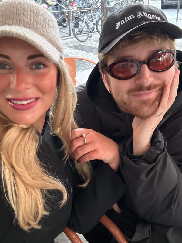 Couple enjoys afternoon at Parisian sidewalk cafe