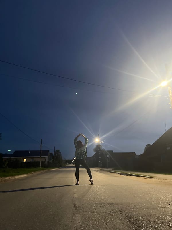 Woman poses on road in Chaikovsky, Russia