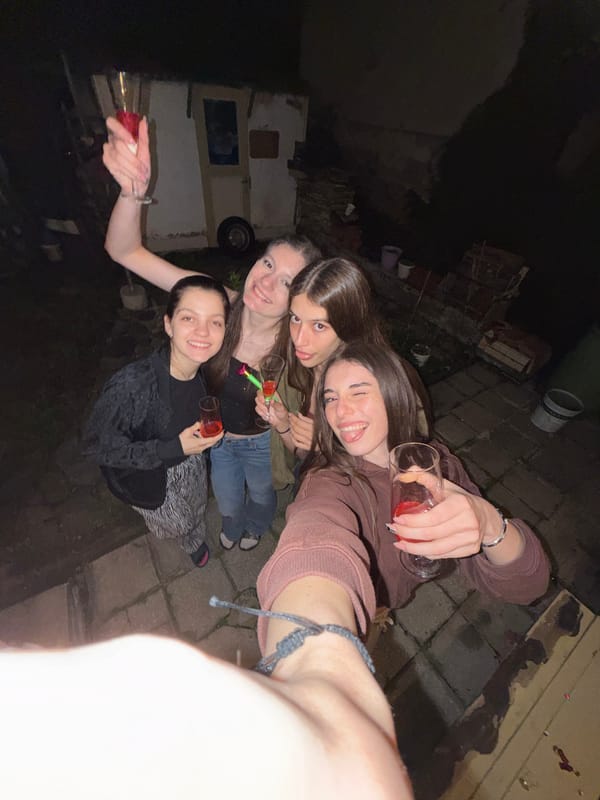 Young women celebrate outdoors at night in Tsar Kaloyan
