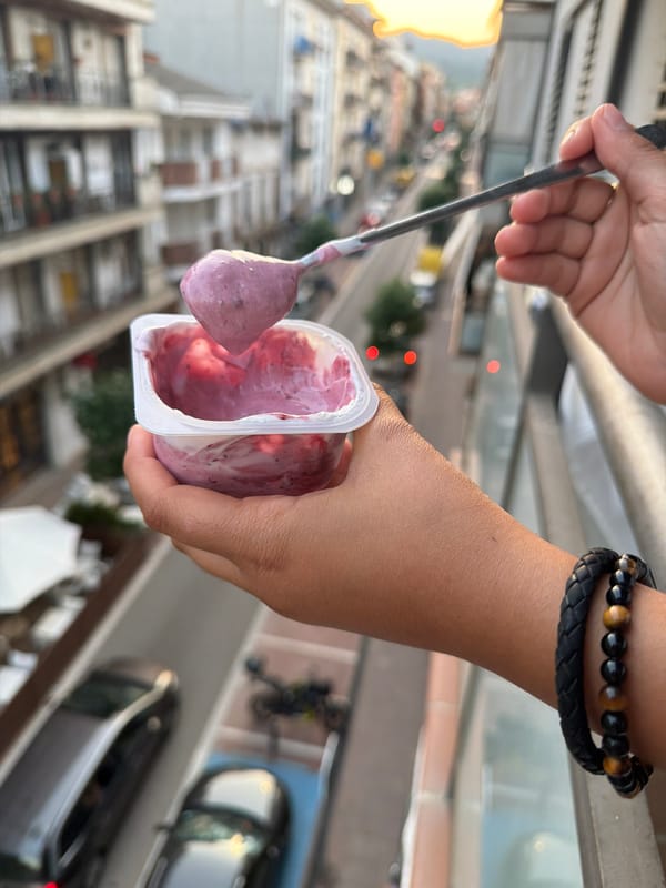 Berry yogurt on a quiet Arbúcies street at golden hour