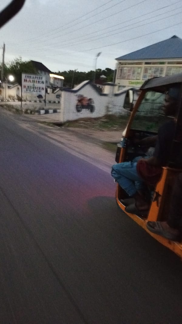 Keke taxi driver operates on Lokoja street