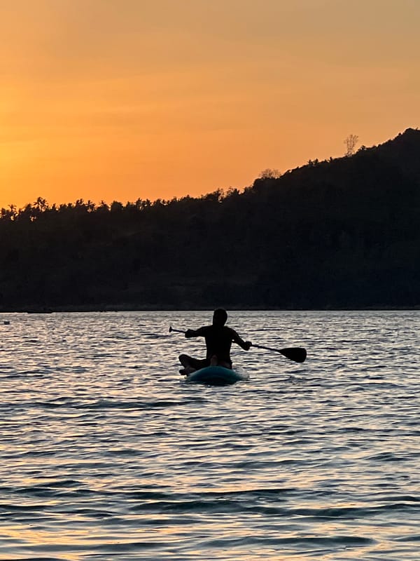 Paddleboard yoga and sunset silhouettes off Ko Pha-ngan