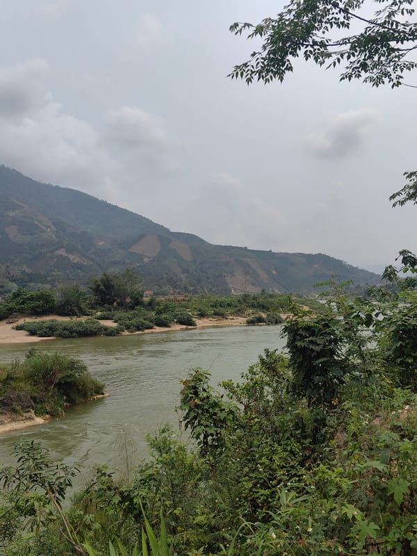 River flows through mountainous valley in Lang Qua, Vietnam