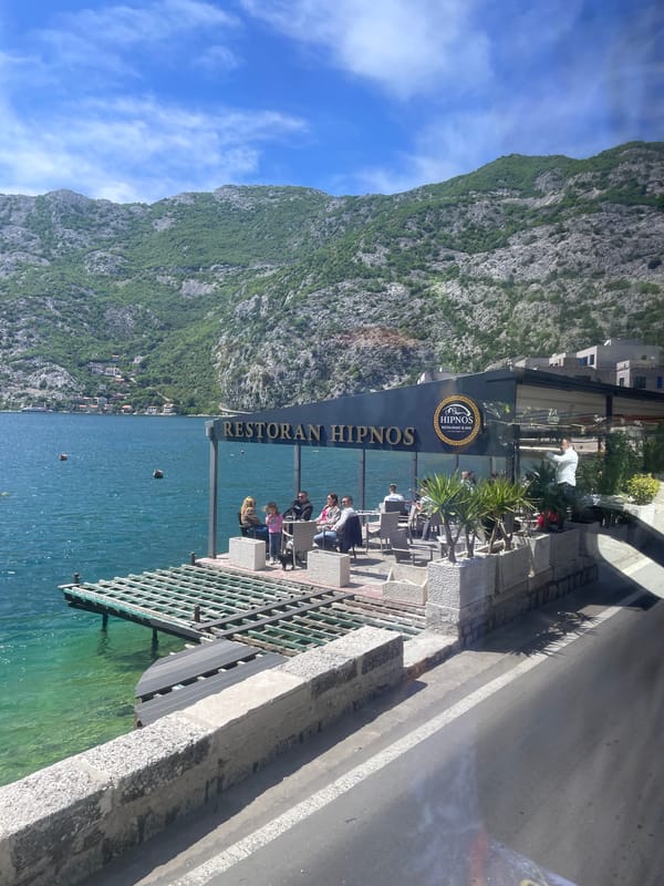 Sunny waterfront day captured in Risan, Montenegro
