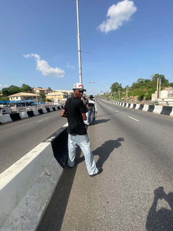 People gather on highway overpass in Lokoja, Nigeria